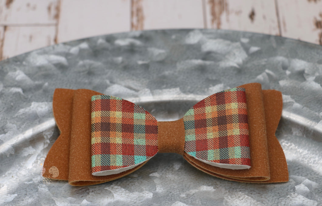 Fall plaid 4.25 inch hair bow.